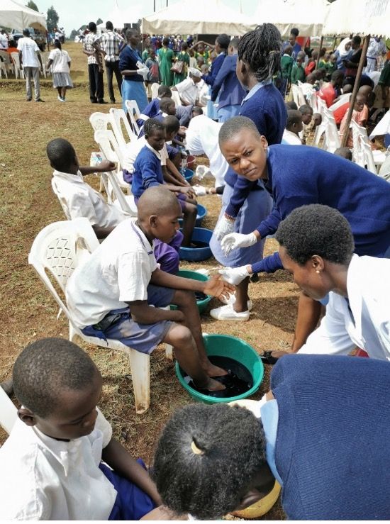 Event where children have their feet cleaned