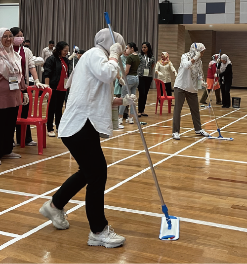 Participant doing a floor cleaning drill