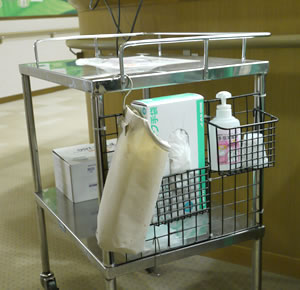Hand disinfectant placed beside a trolley.
