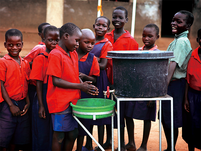 Children in Uganda washing their hands to promote Unicef's Wash A Million Hands Campaign